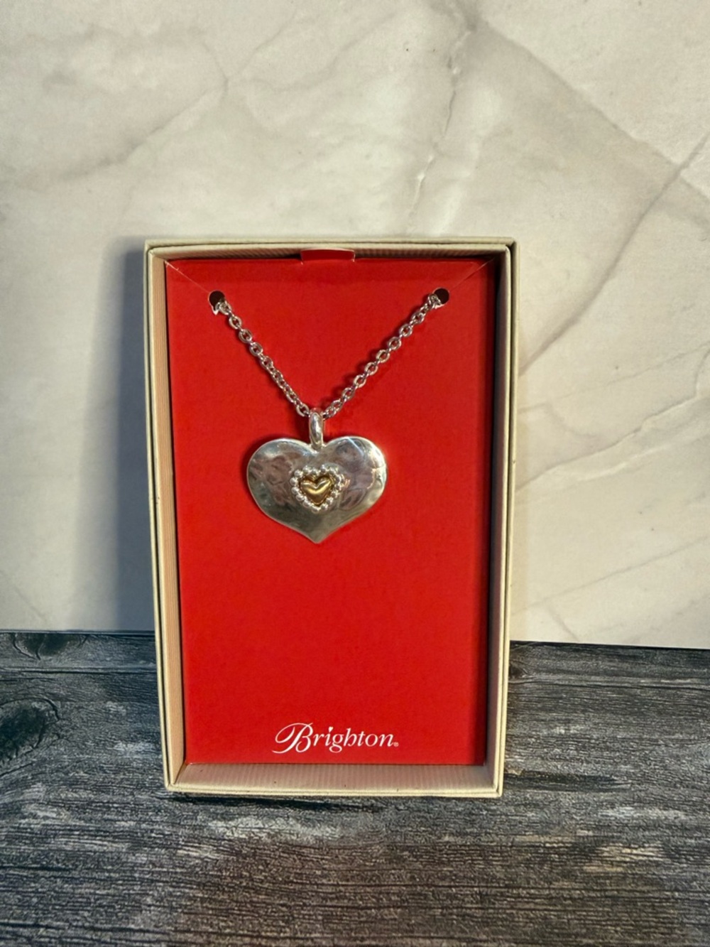 NWT Brighton “Love beyond words” necklace silver heart w/gold heart on it.
